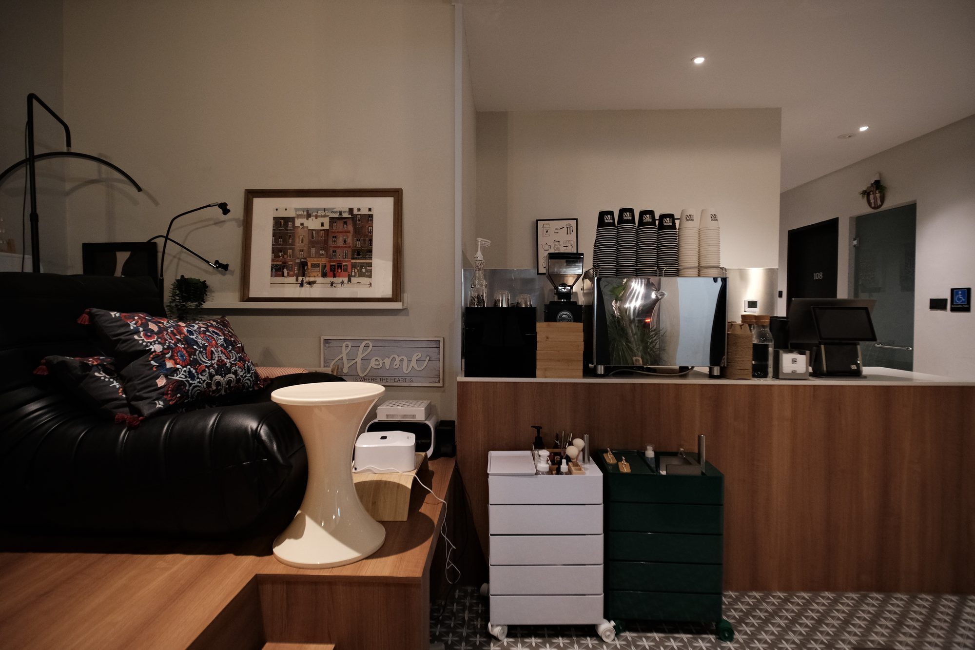 Black framed shopfront of Seek In Nail and Cafe manicure café Singapore at night